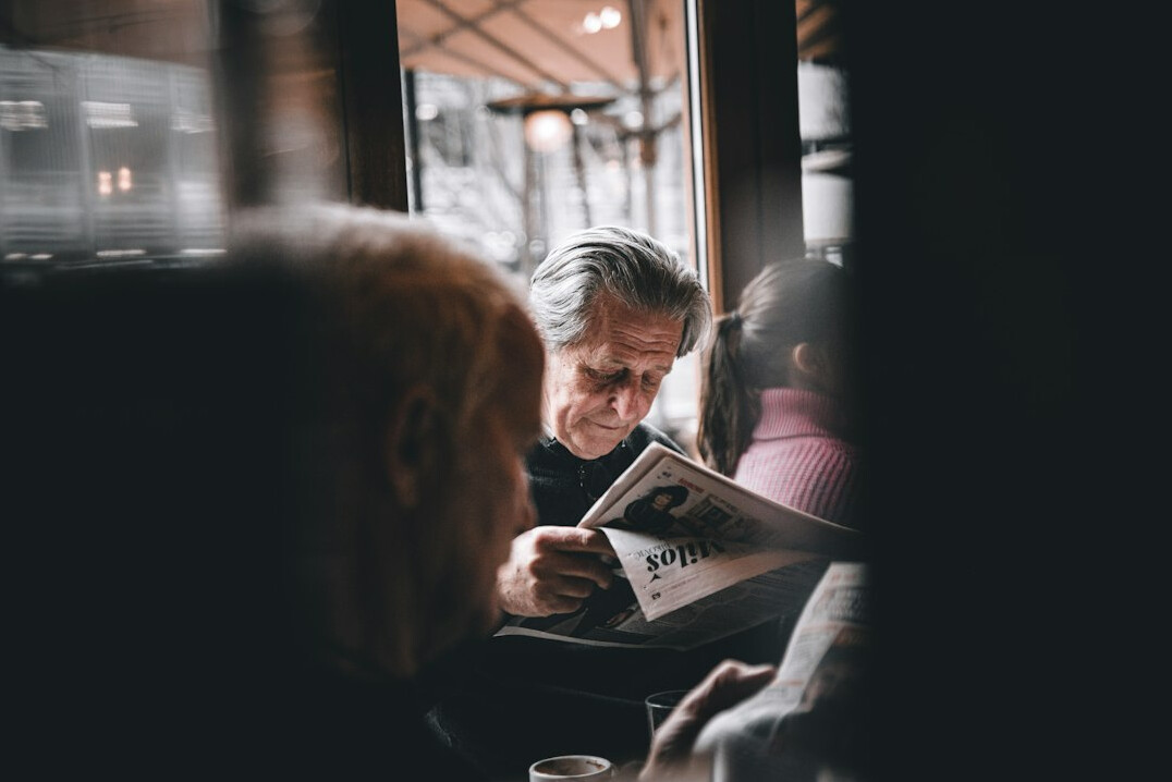 person reading newspaper